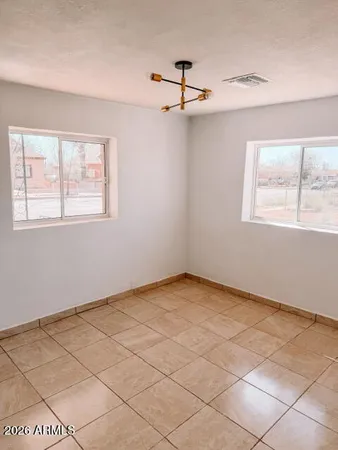 a view of an empty room with a window