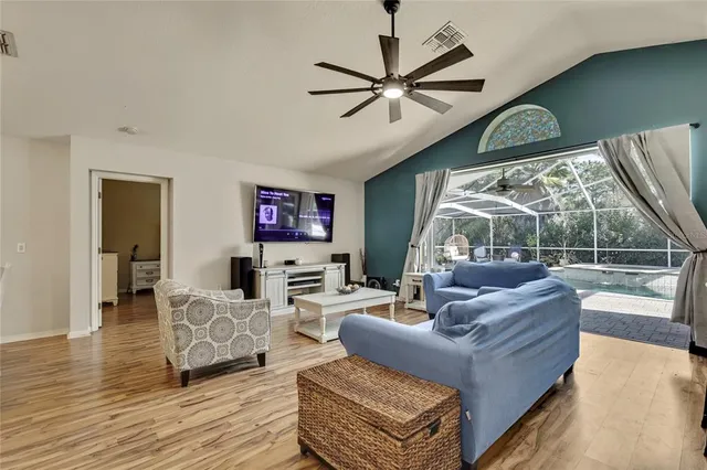 a view of a dining room with furniture and wooden floor