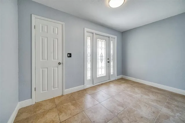 a view of an empty room and window