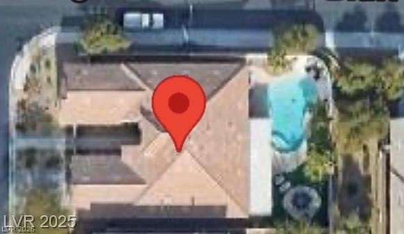 7524 Midnight Rambler Street Las Vegas, NV 89149 - Photo 48 of 51 An aerial perspective reveals a private pool alongside the residential structure, highlighted by a prominent location marker.