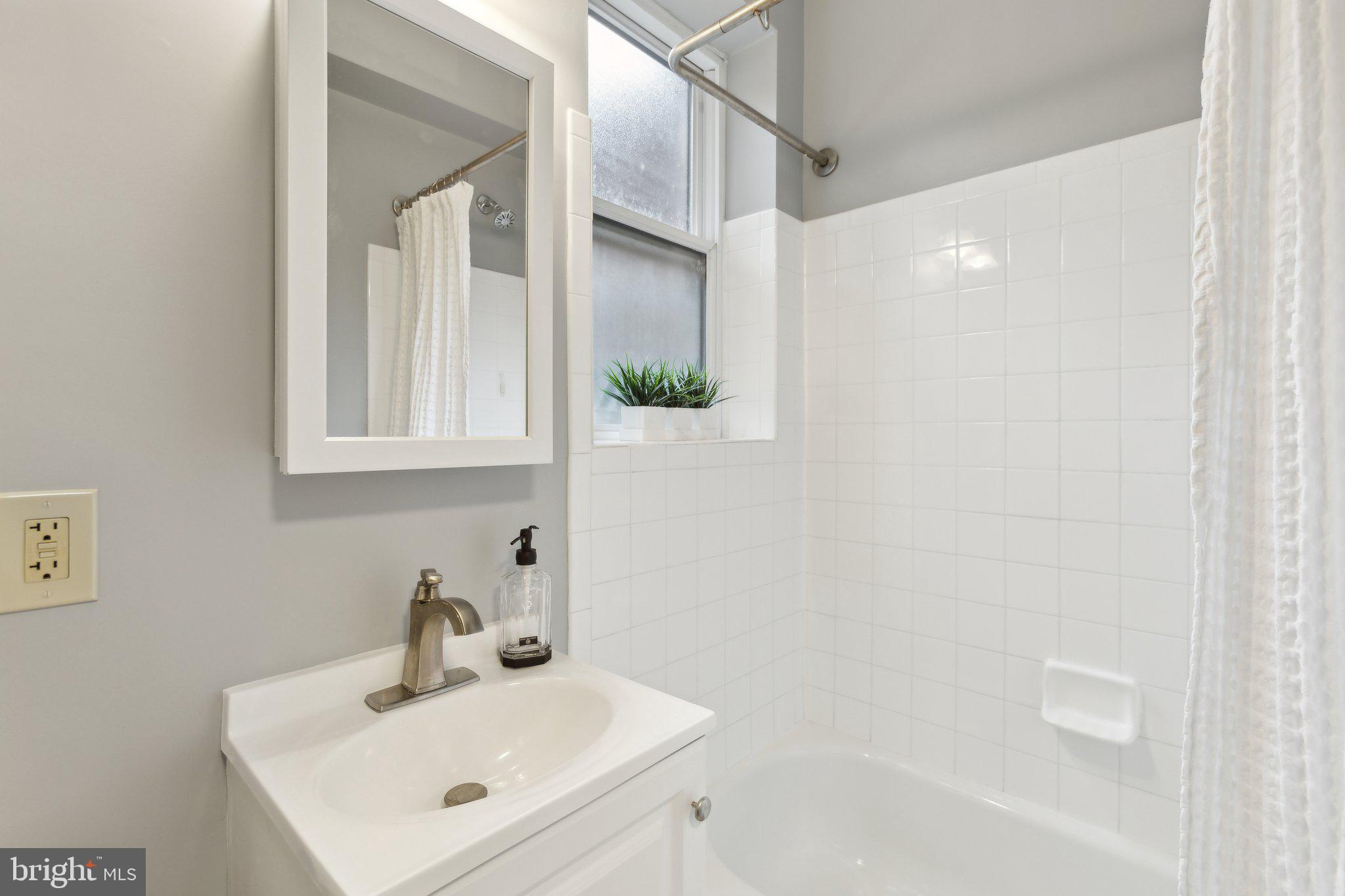 1458 Columbia Road Northwest, Unit 401 Washington, DC 20009 - Photo 11 of 14 The full bathroom has a large window