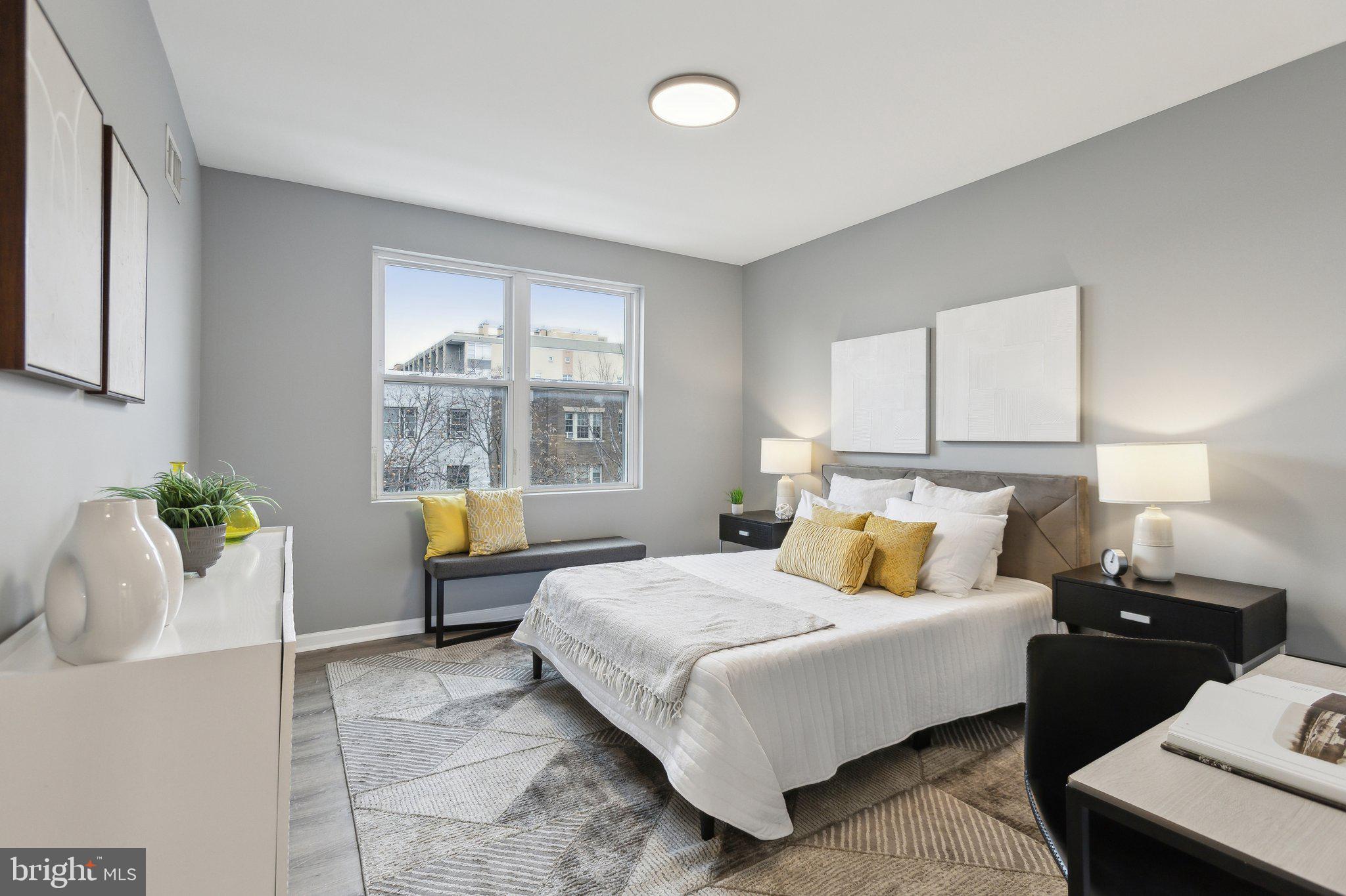 Large bedroom with a lot of natural light