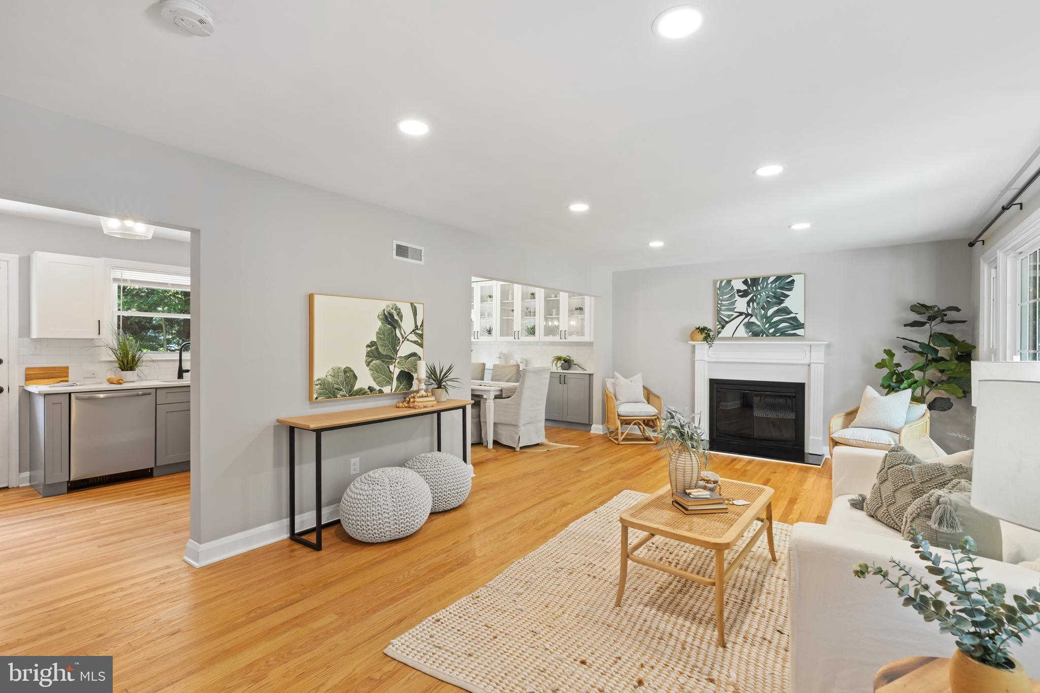 7003 Wardman Road Baltimore, MD 21212 - Photo 1 of 42 a living room with furniture a fireplace and a potted plant