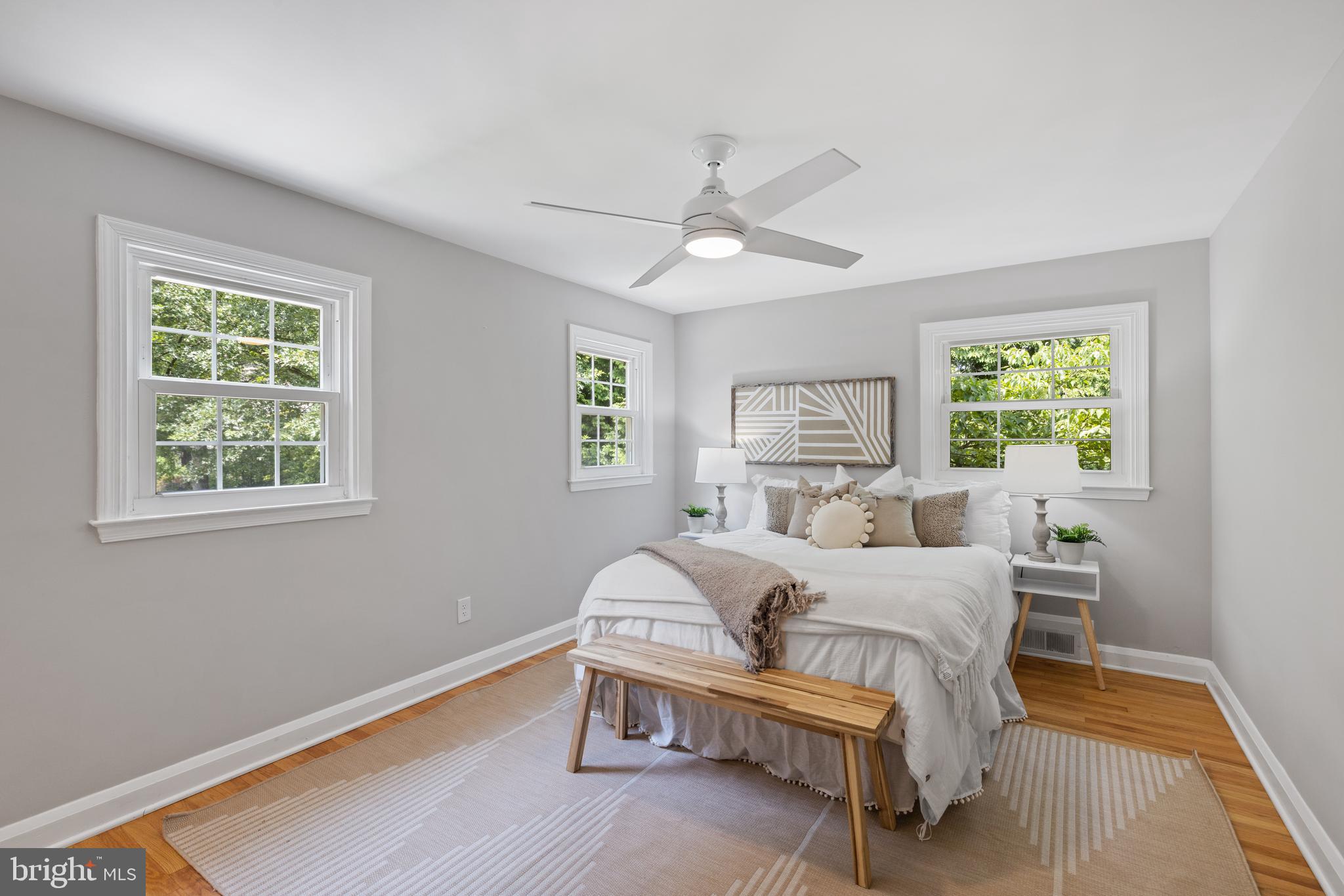7003 Wardman Road Baltimore, MD 21212 - Photo 19 of 42 a bedroom with a bed wooden floor and window