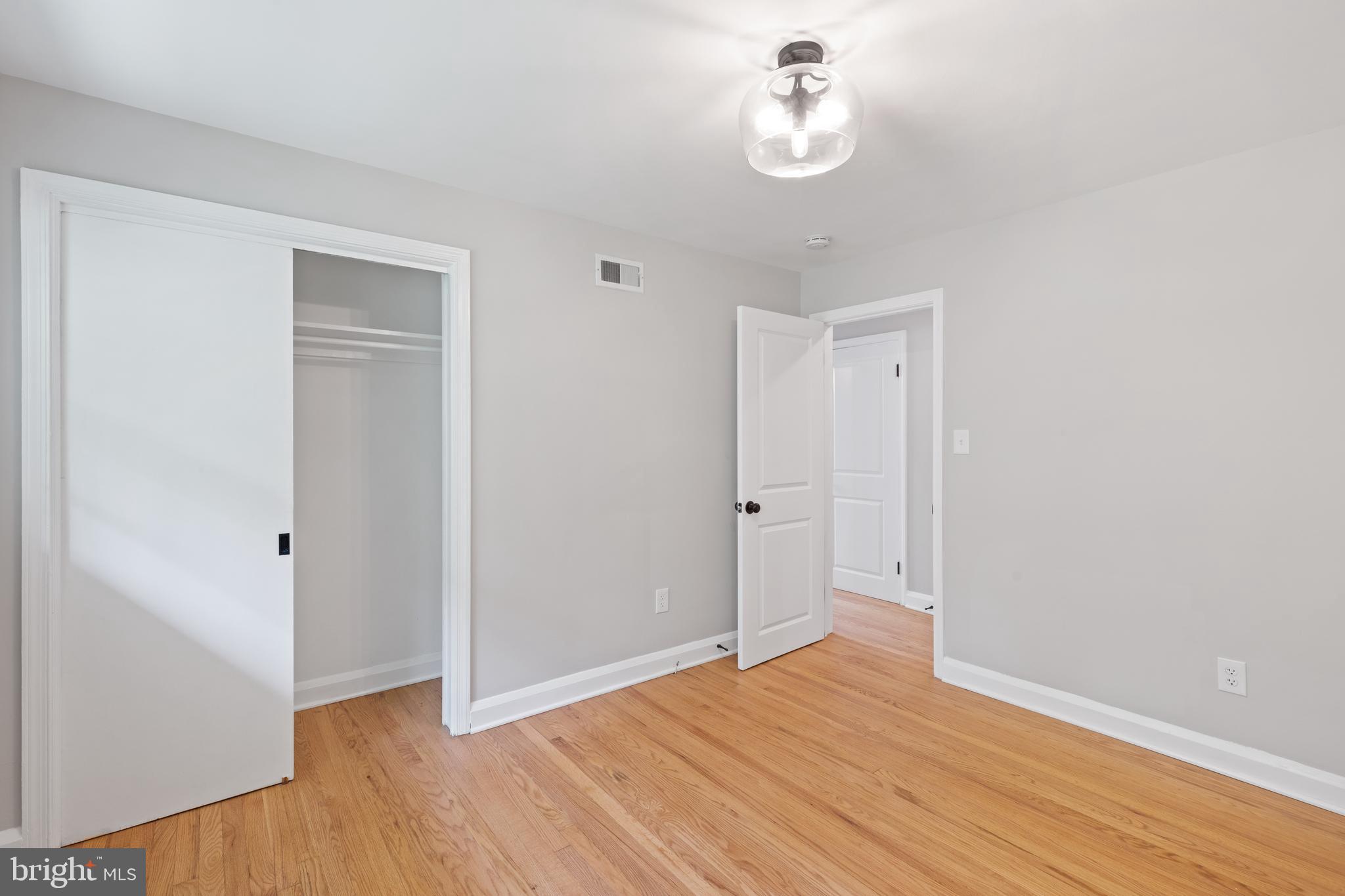 7003 Wardman Road Baltimore, MD 21212 - Photo 24 of 42 wooden floor in an empty room