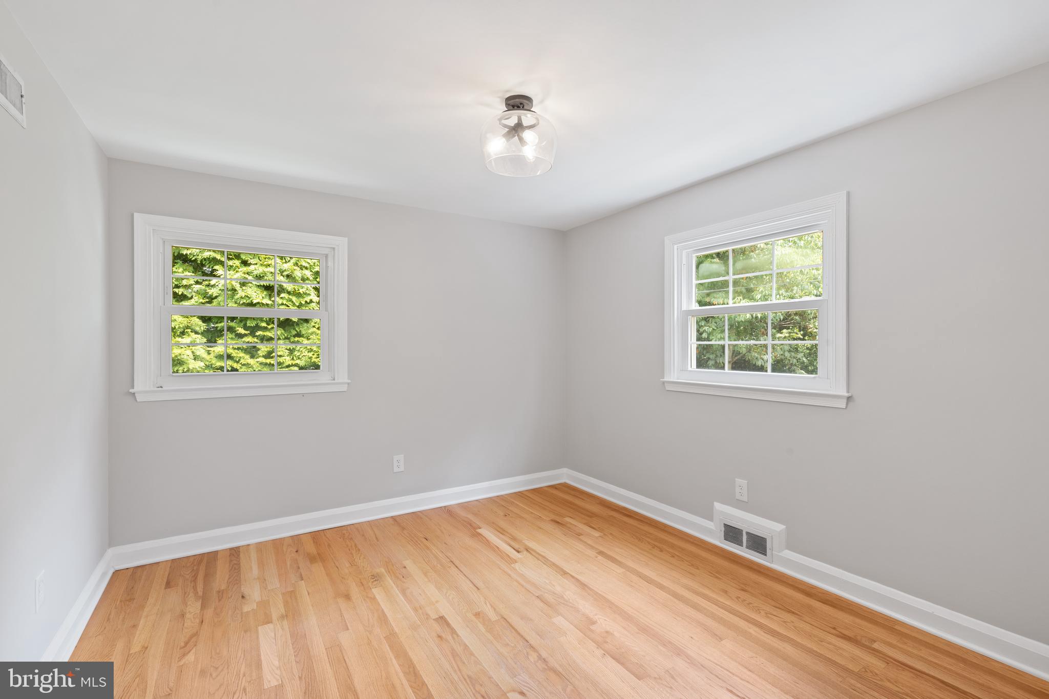7003 Wardman Road Baltimore, MD 21212 - Photo 25 of 42 a view of empty room with window and ceiling fan