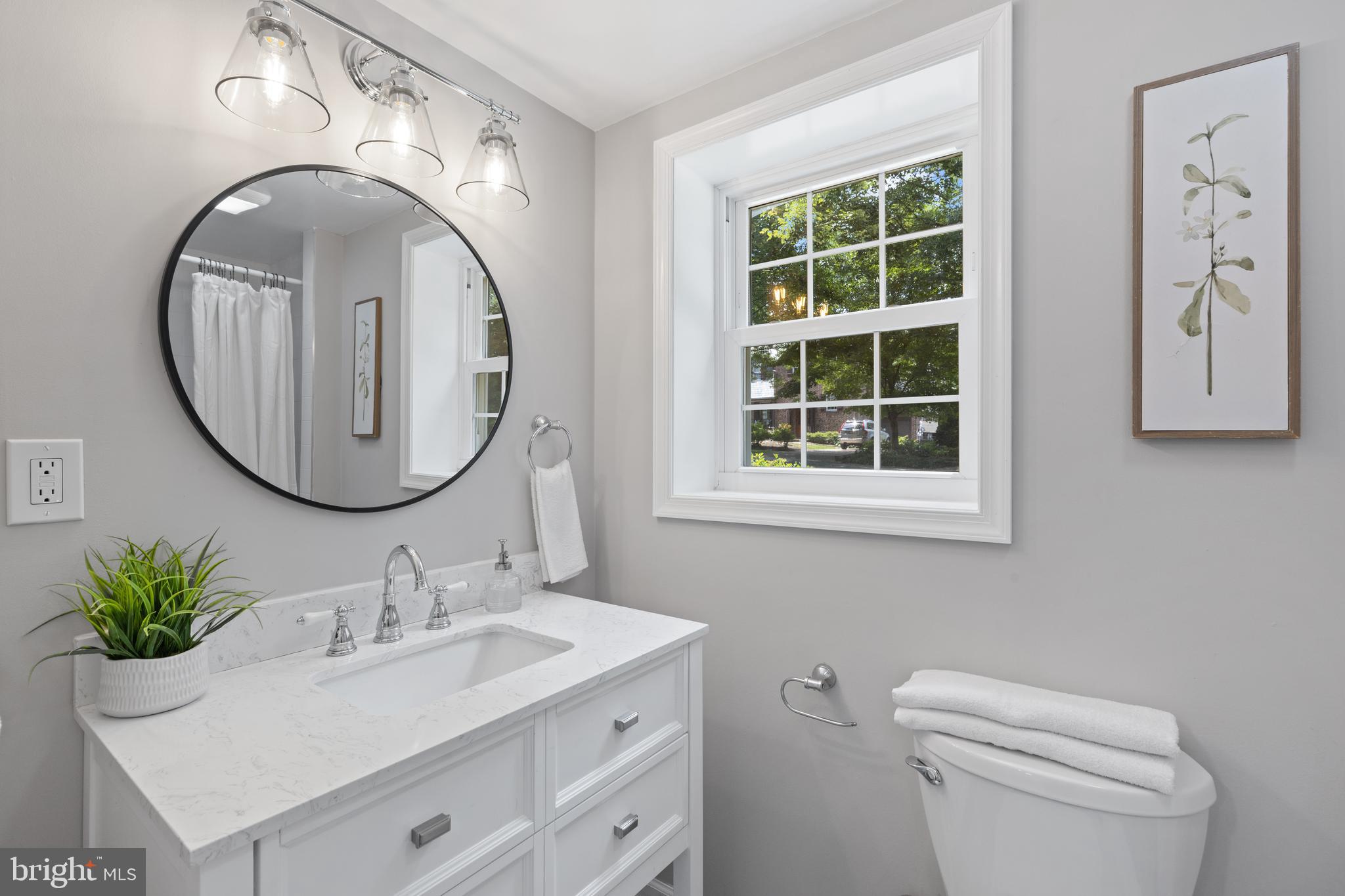 7003 Wardman Road Baltimore, MD 21212 - Photo 37 of 42 a bathroom with a sink and a mirror