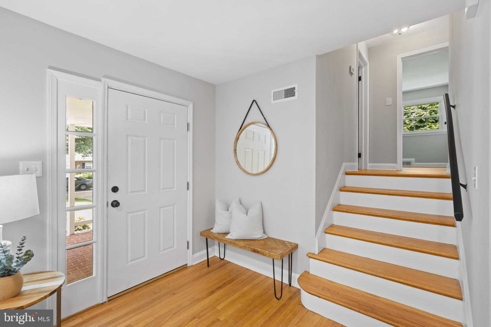7003 Wardman Road Baltimore, MD 21212 - Photo 4 of 42 a bedroom with a bed and a chandelier