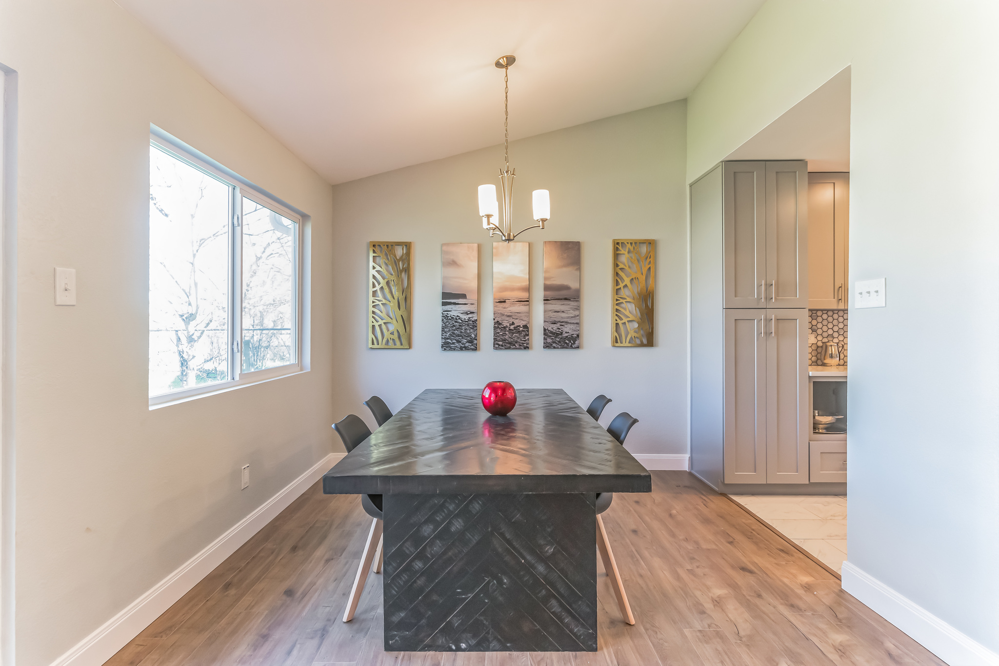 11406 Ruffed Grouse Drive Austin, TX 78758 - Photo 11 of 22 Hardwood floors and a vaulted ceiling anchor this welcoming dining space.
