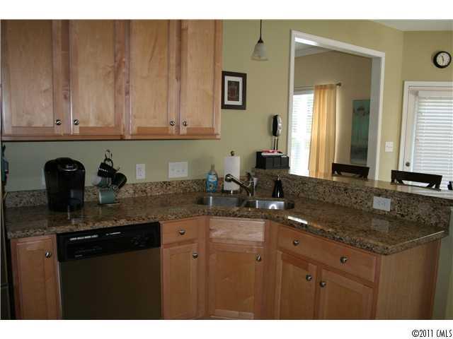 1826 Sam Smith Road, Unit 3 Fort Mill, SC 29708 - Photo 2 of 16 a kitchen with sink and cabinets
