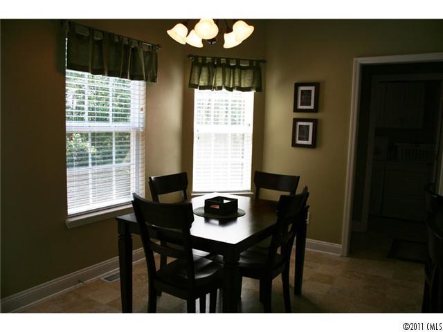 1826 Sam Smith Road, Unit 3 Fort Mill, SC 29708 - Photo 4 of 16 a dining room with furniture and window