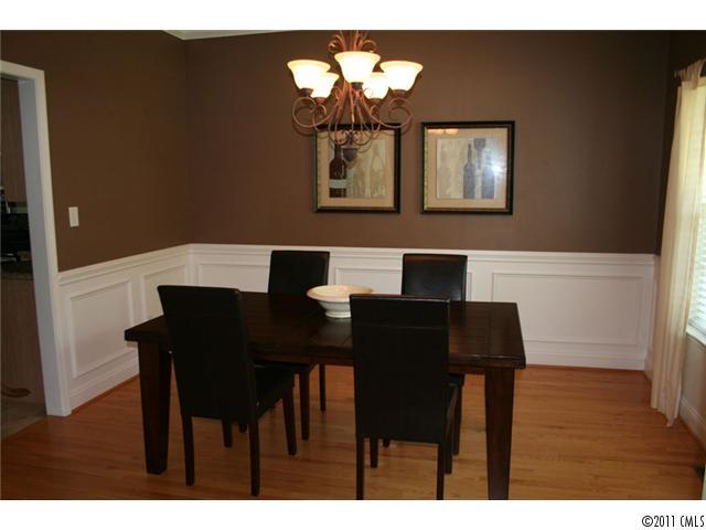 1826 Sam Smith Road, Unit 3 Fort Mill, SC 29708 - Photo 7 of 16 a view of a dining room with furniture and wooden floor