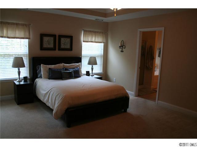 1826 Sam Smith Road, Unit 3 Fort Mill, SC 29708 - Photo 8 of 16 a bedroom with a bed and a window