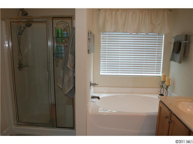 1826 Sam Smith Road, Unit 3 Fort Mill, SC 29708 - Photo 9 of 16 a bathroom with a bathtub and a sink