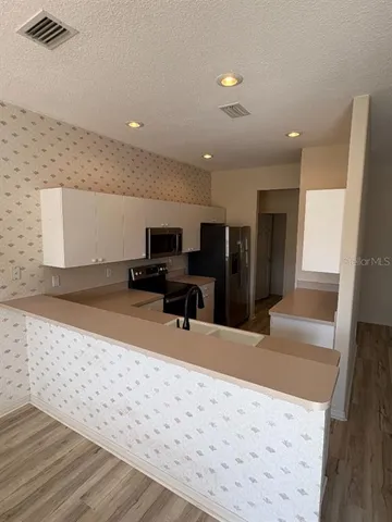 a bathroom with a sink and mirror