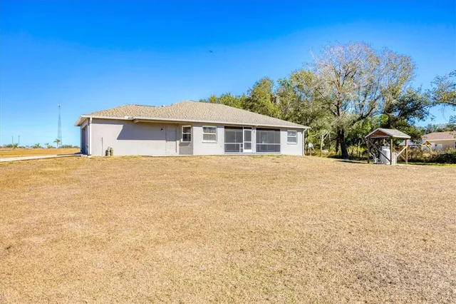 a view of a lake with a yard