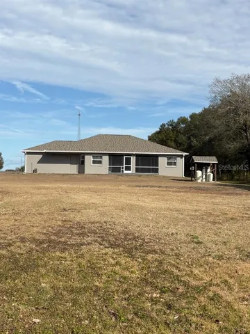 a bedroom with a bed and a night stand