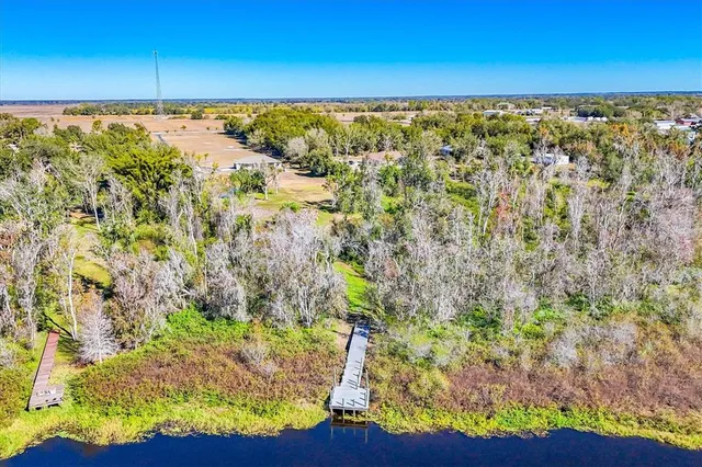 a view of small house with wooden fence