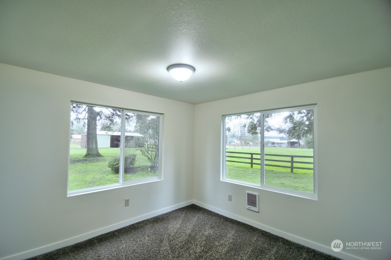 20020 Carper Road Southwest Rochester, WA 98579 - Photo 23 of 35 a view of an empty room with a window