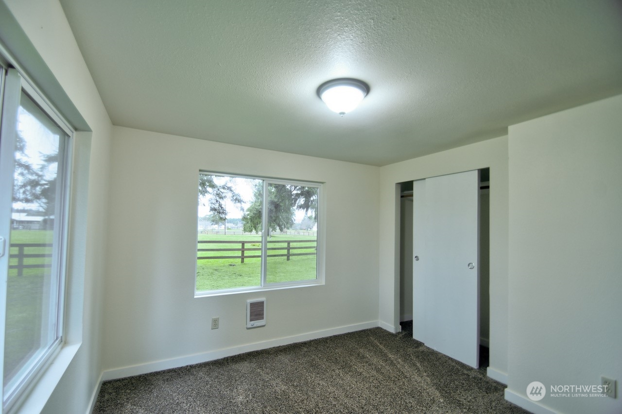 20020 Carper Road Southwest Rochester, WA 98579 - Photo 24 of 35 an empty room with windows