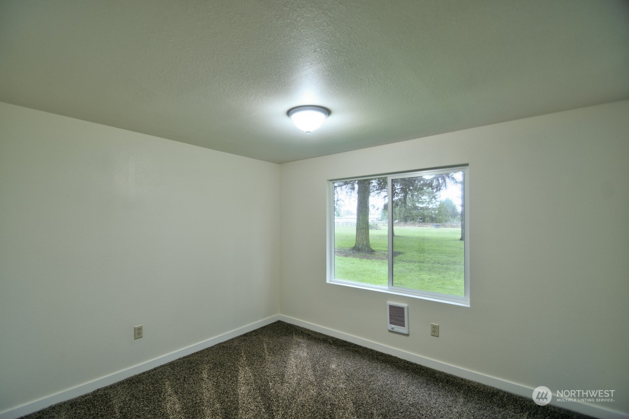 20020 Carper Road Southwest Rochester, WA 98579 - Photo 25 of 35 an empty room with a window