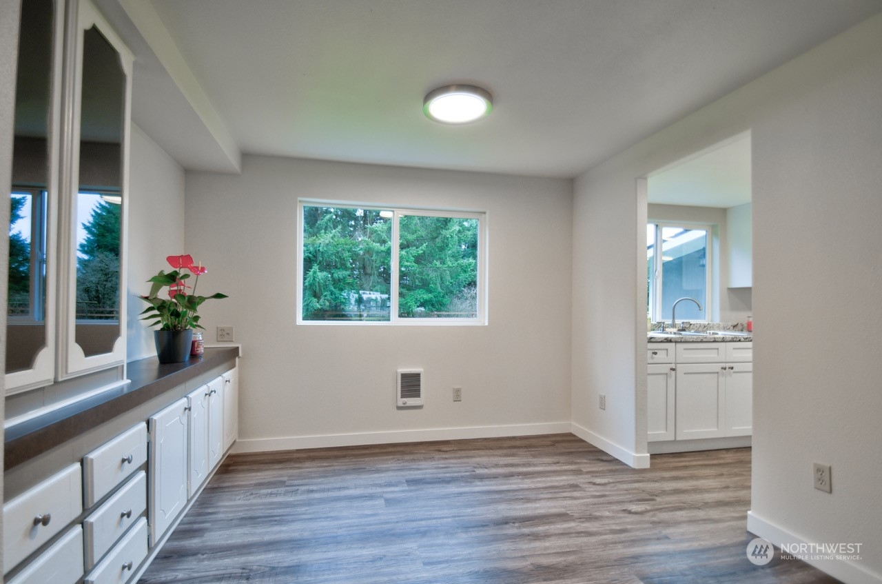 20020 Carper Road Southwest Rochester, WA 98579 - Photo 10 of 35 wooden floor in an empty room with a window