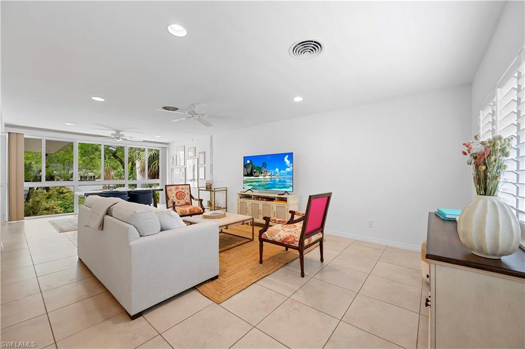 1340 Crayton Road, Unit 4 Naples, FL 34102 - Photo 12 of 22 Living area with light tile patterned floors, recessed lighting, and a ceiling fan