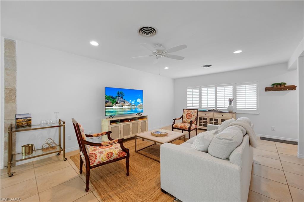 1340 Crayton Road, Unit 4 Naples, FL 34102 - Photo 14 of 22 Living area with light tile patterned floors, ceiling fan, and recessed lighting