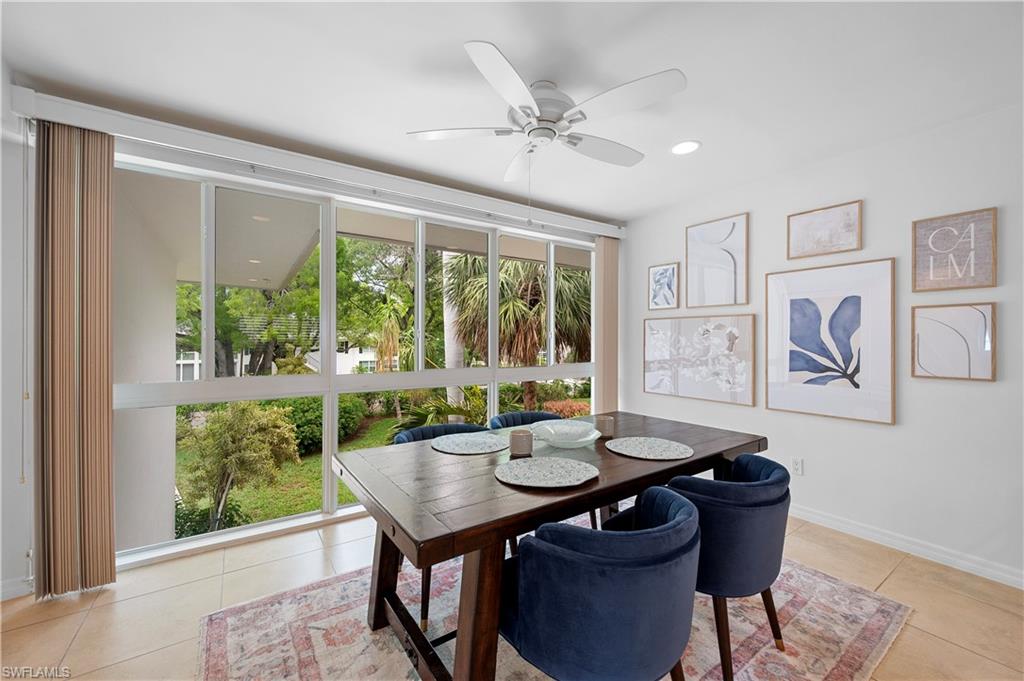 1340 Crayton Road, Unit 4 Naples, FL 34102 - Photo 20 of 22 Dining space featuring expansive windows, a ceiling fan, light tile patterned floors, and recessed lighting