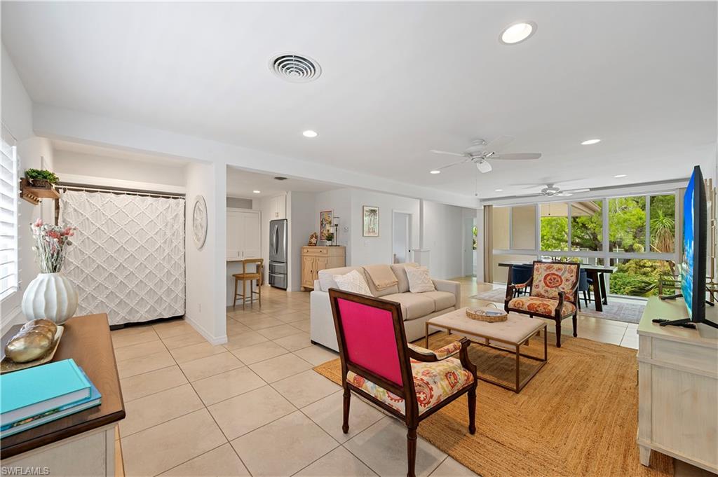 1340 Crayton Road, Unit 4 Naples, FL 34102 - Photo 4 of 22 Living room with plenty of natural light, light tile patterned floors, a ceiling fan, and recessed lighting