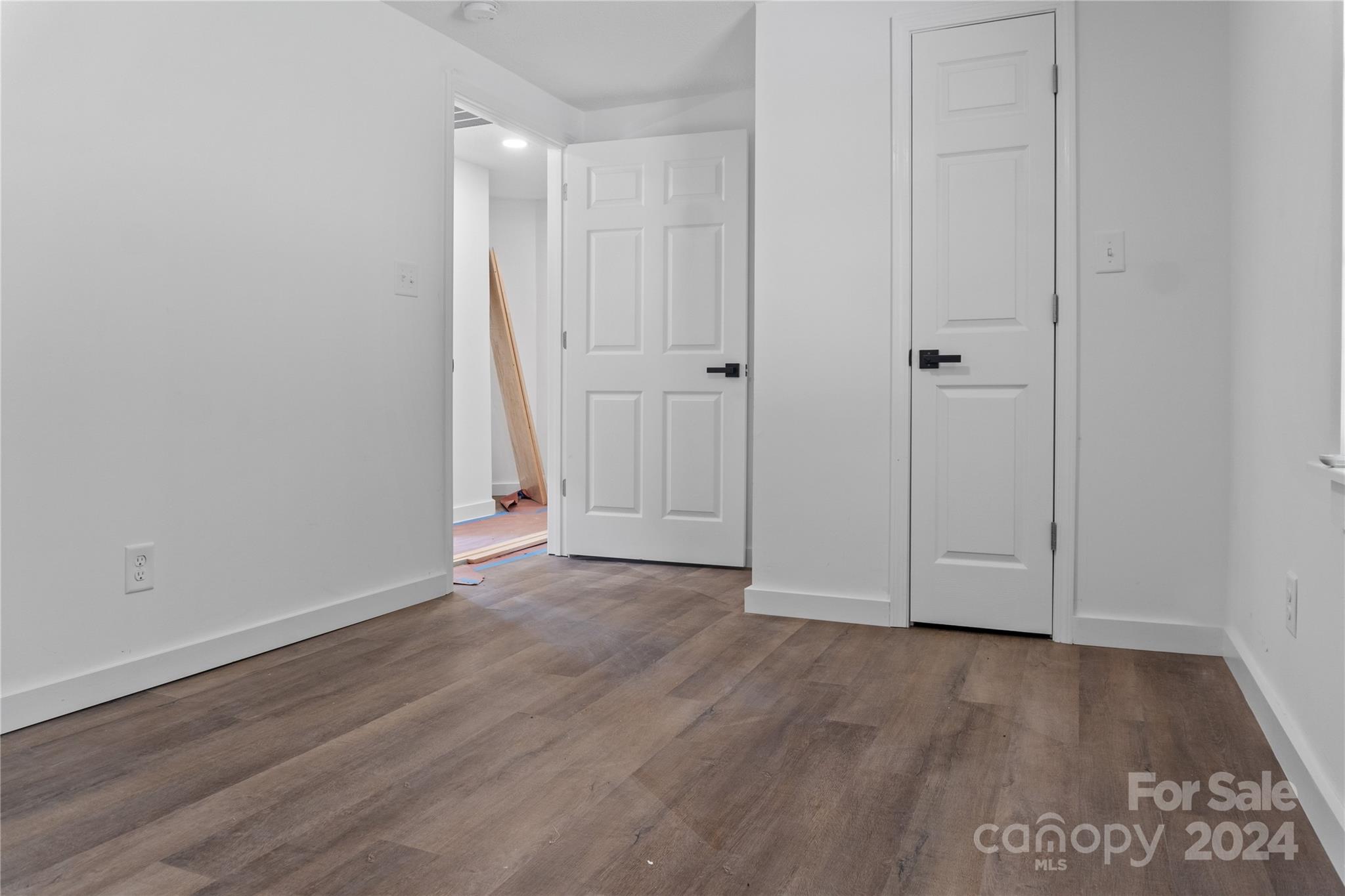 4879 Joe Powell Road Morganton, NC 28655 - Photo 16 of 35 a view of an empty room with wooden floor