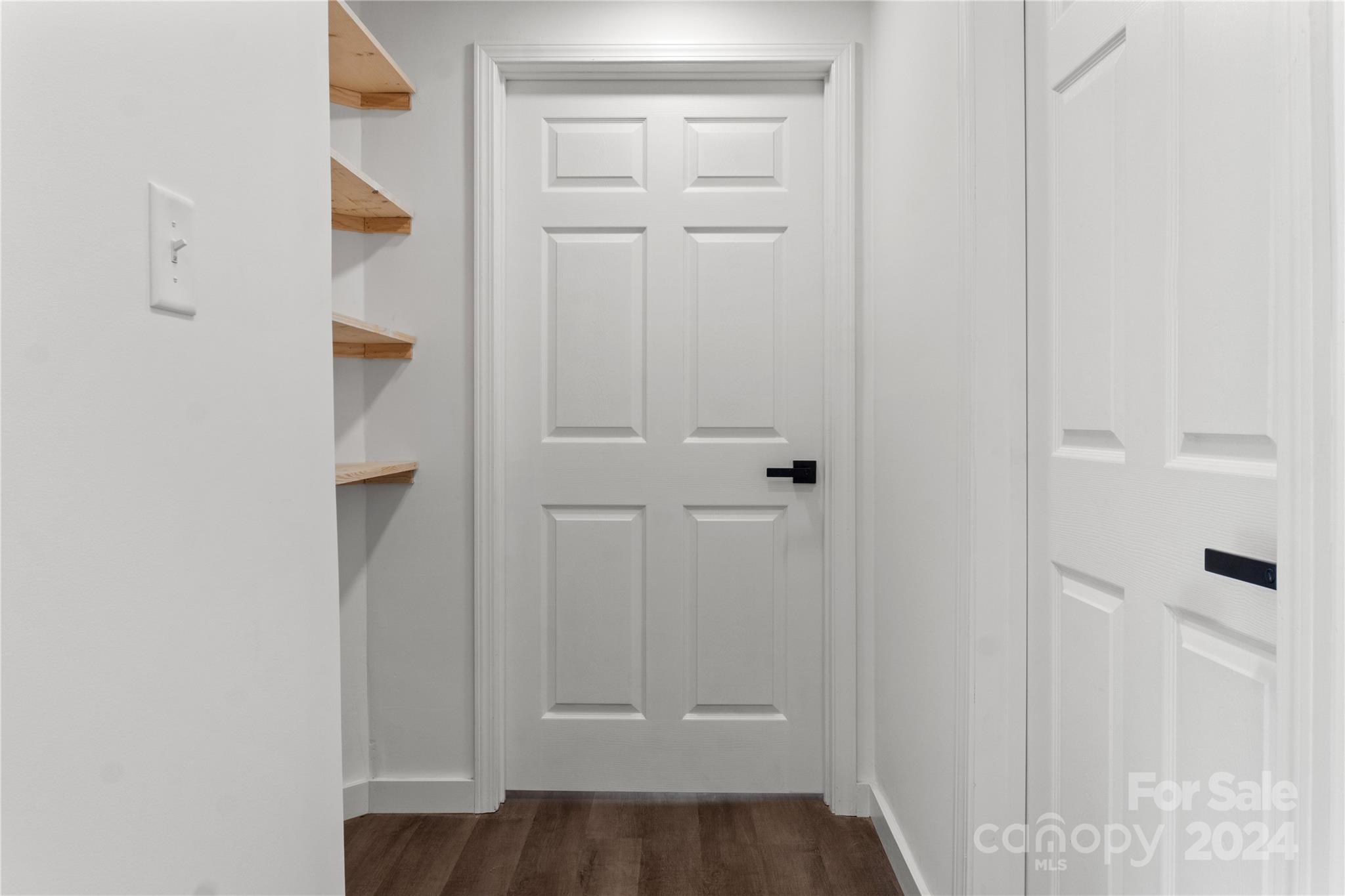 4879 Joe Powell Road Morganton, NC 28655 - Photo 18 of 35 an empty room with wooden floor and closet