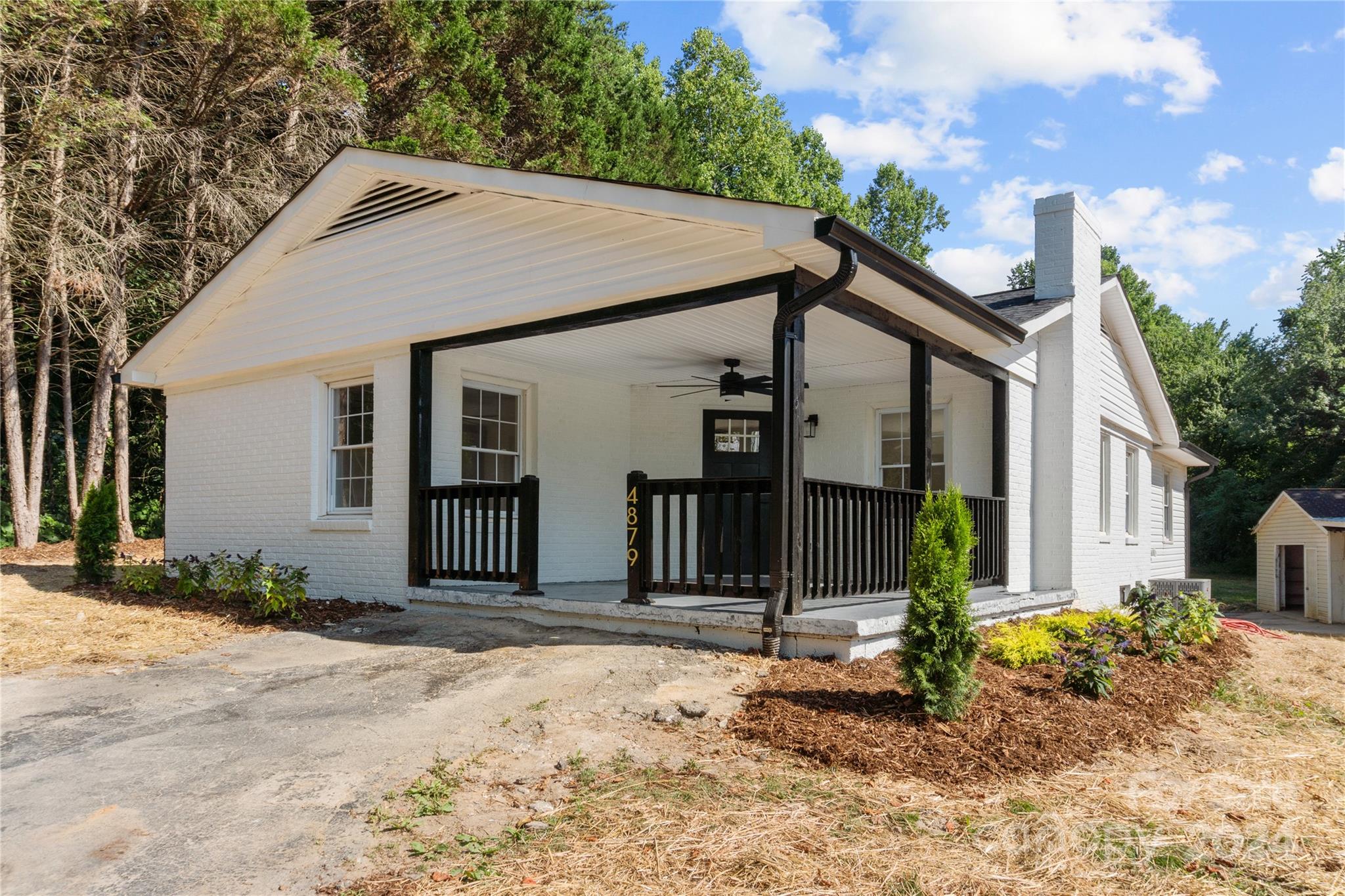 4879 Joe Powell Road Morganton, NC 28655 - Photo 2 of 35 a front view of a house with a yard and garage