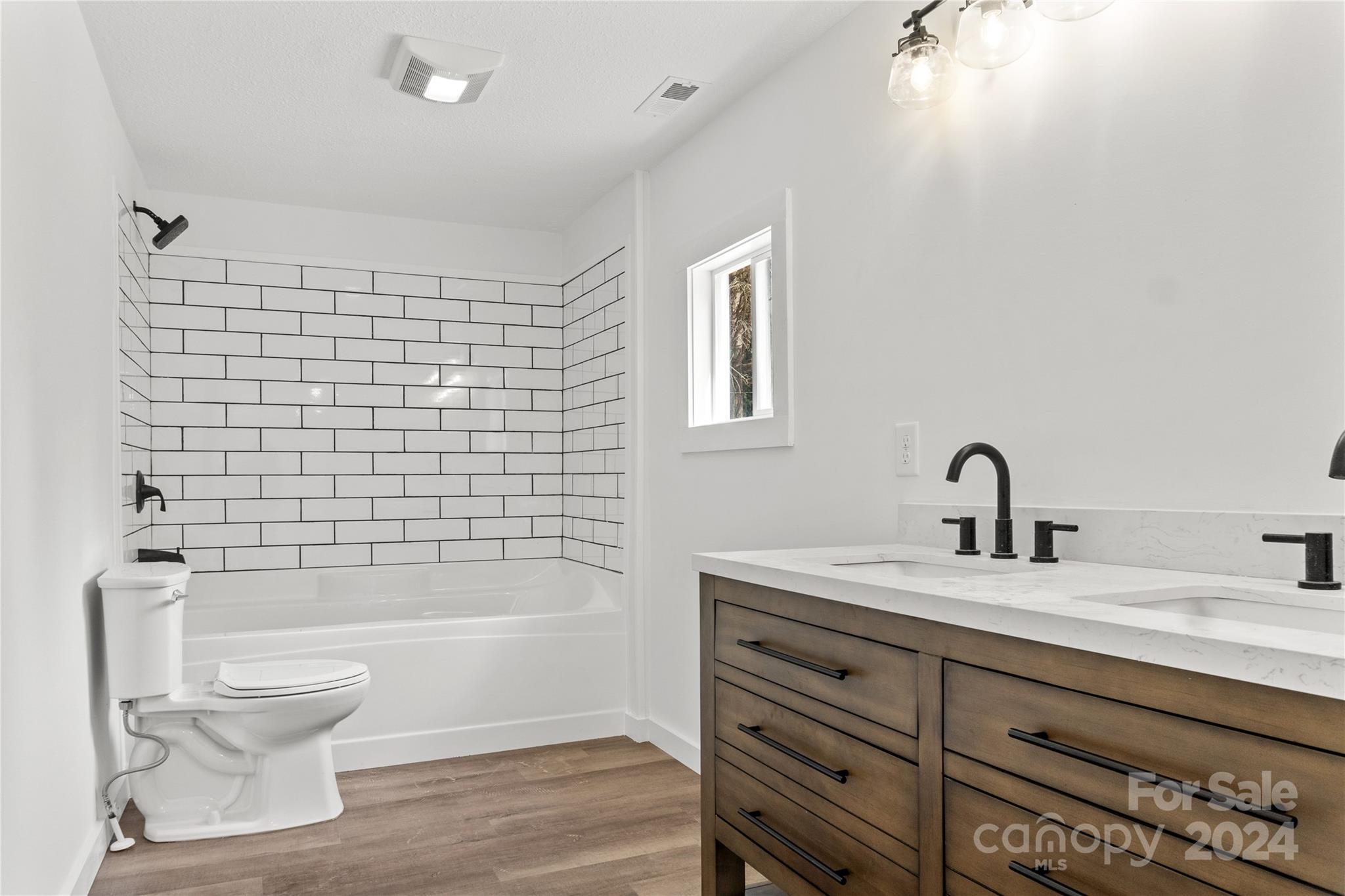 4879 Joe Powell Road Morganton, NC 28655 - Photo 27 of 35 a bathroom with a sink toilet and shower