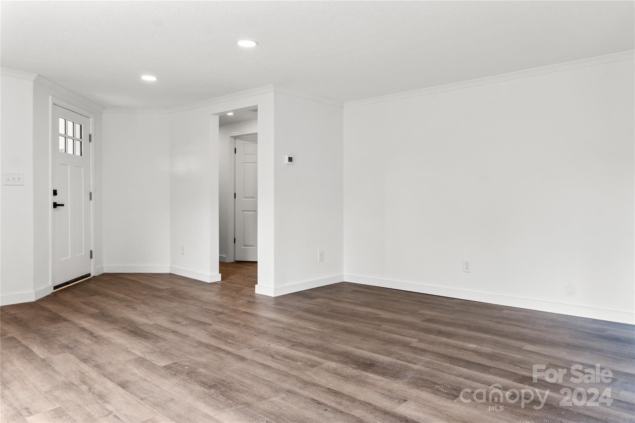 4879 Joe Powell Road Morganton, NC 28655 - Photo 30 of 35 a view of an empty room with wooden floor and closet