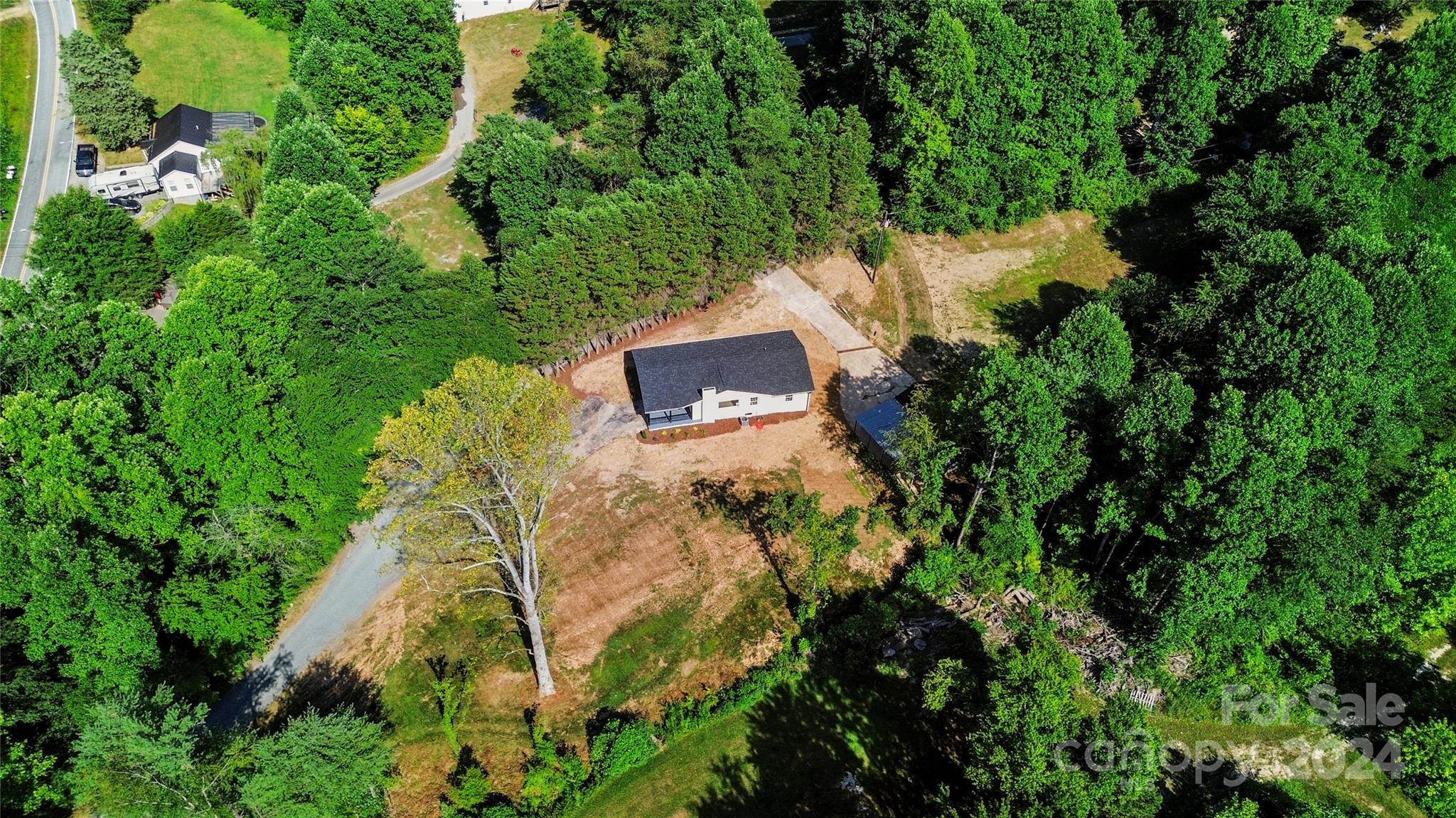 4879 Joe Powell Road Morganton, NC 28655 - Photo 32 of 35 an aerial view of a house with a yard