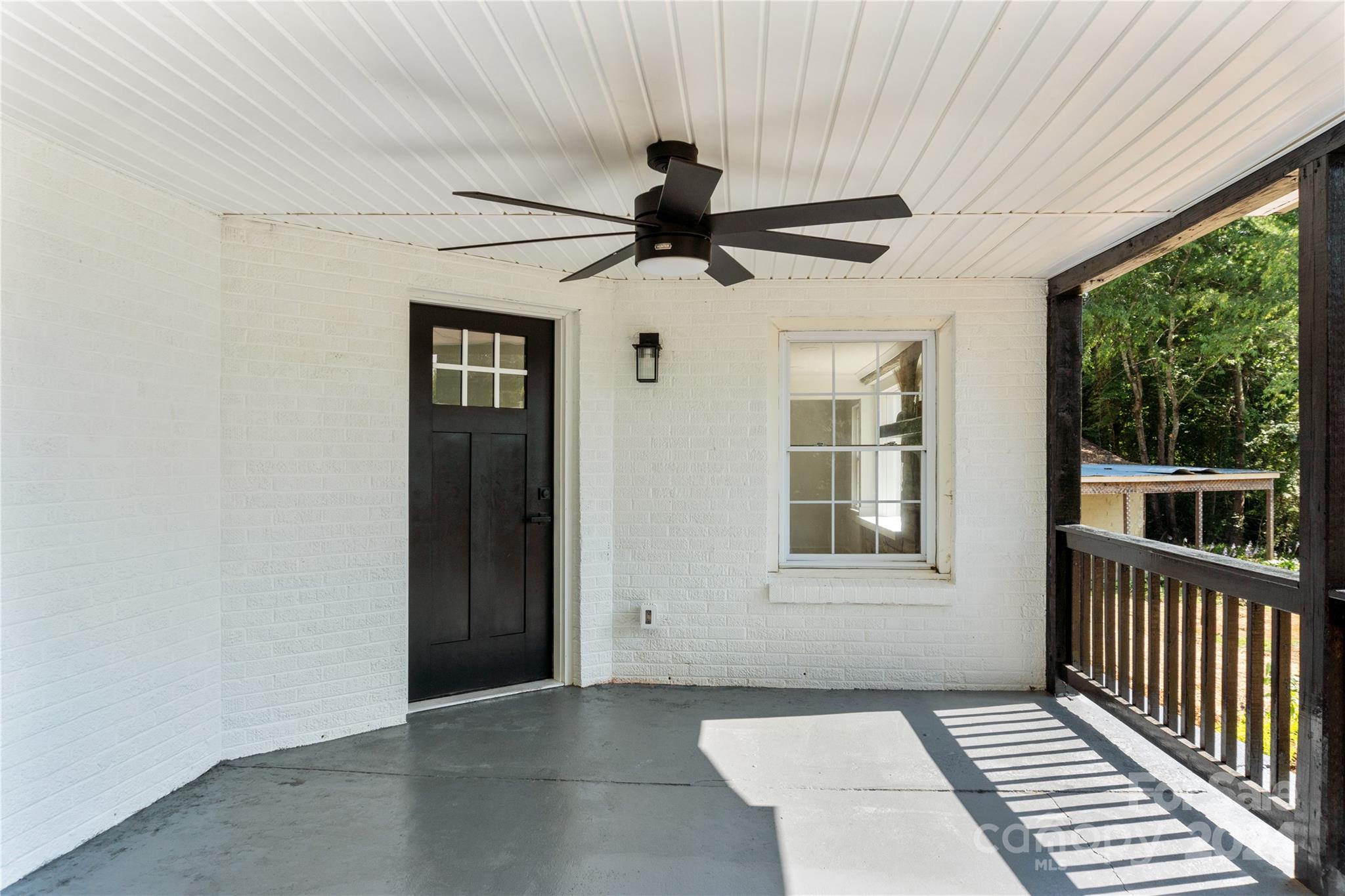 4879 Joe Powell Road Morganton, NC 28655 - Photo 6 of 35 a view of a livingroom with a ceiling fan and window