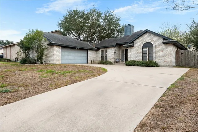 a house with trees in the background