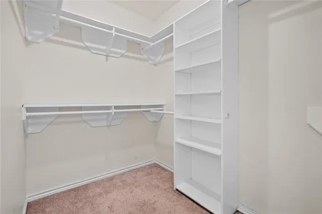 a view of an empty walk in closet