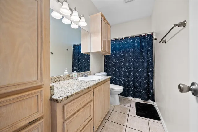 a bathroom with a sink a vanity and a shower