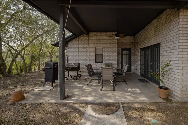 a view of backyard with sitting area