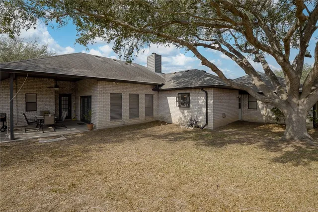 a house with a tree in front of it