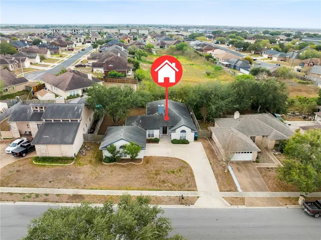 an aerial view of residential house with outdoor space