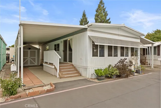 a front view of a house with stairs