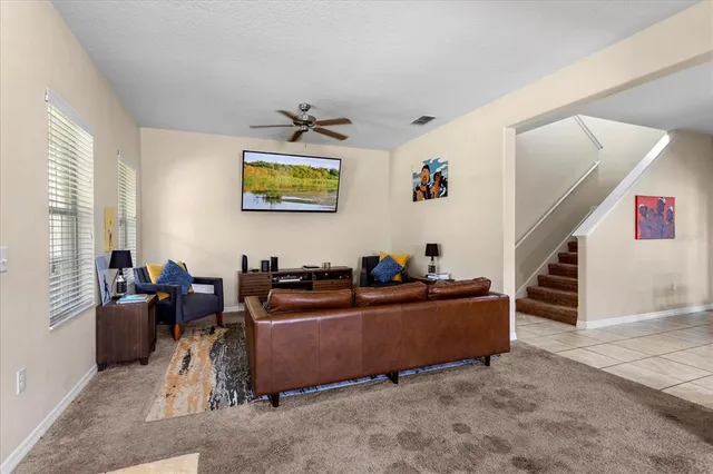 a living room with furniture and windows
