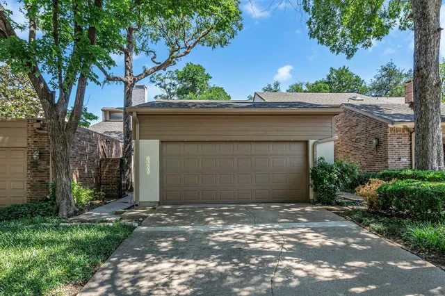 a front view of a house with a garage