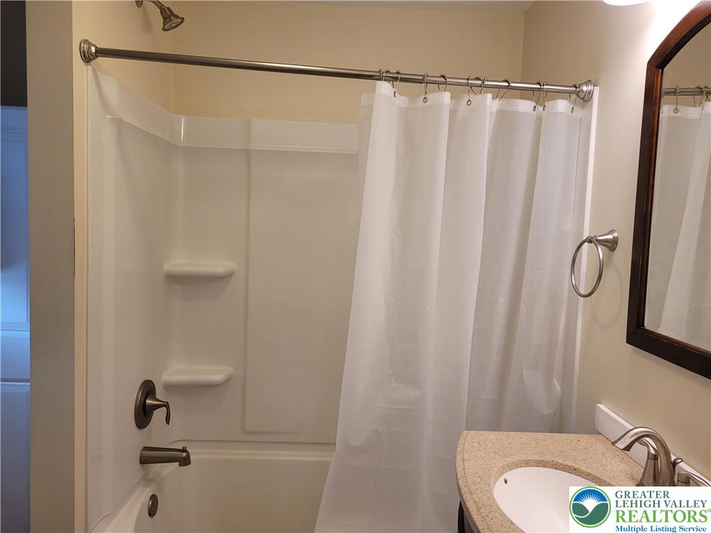 1024 Delaware Avenue, Unit 1 Bethlehem, PA 18015 - Photo 17 of 17 a bathroom with a sink and a mirror