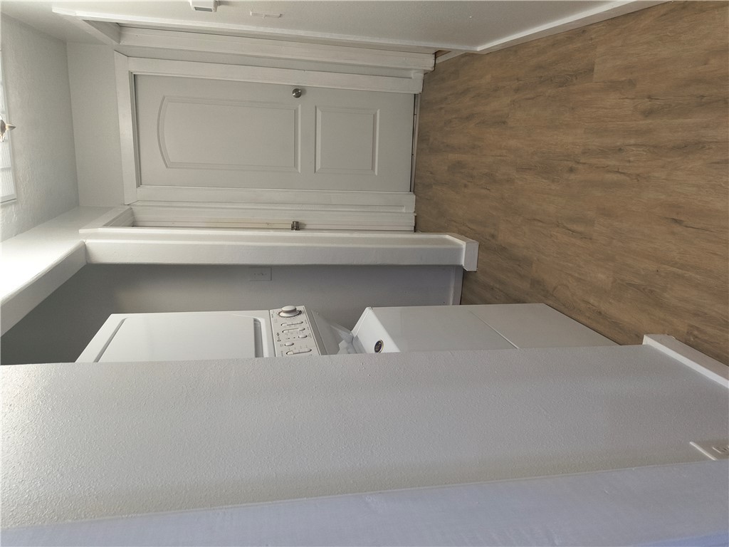 611 Wheelock Street Franklin, TX 77856 - Photo 6 of 8 a view of a hallway with wooden floor and a sink