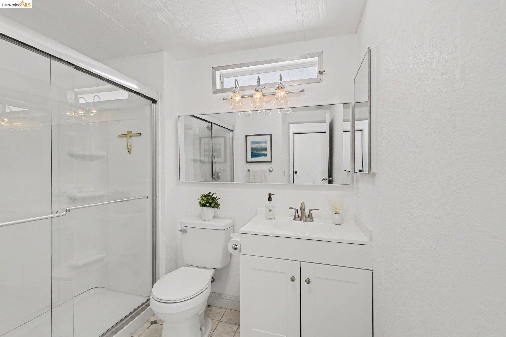 36 Cayuga Street Oakley, CA 94561 - Photo 16 of 25 Bathroom with vanity, a shower stall, and light tile patterned floors