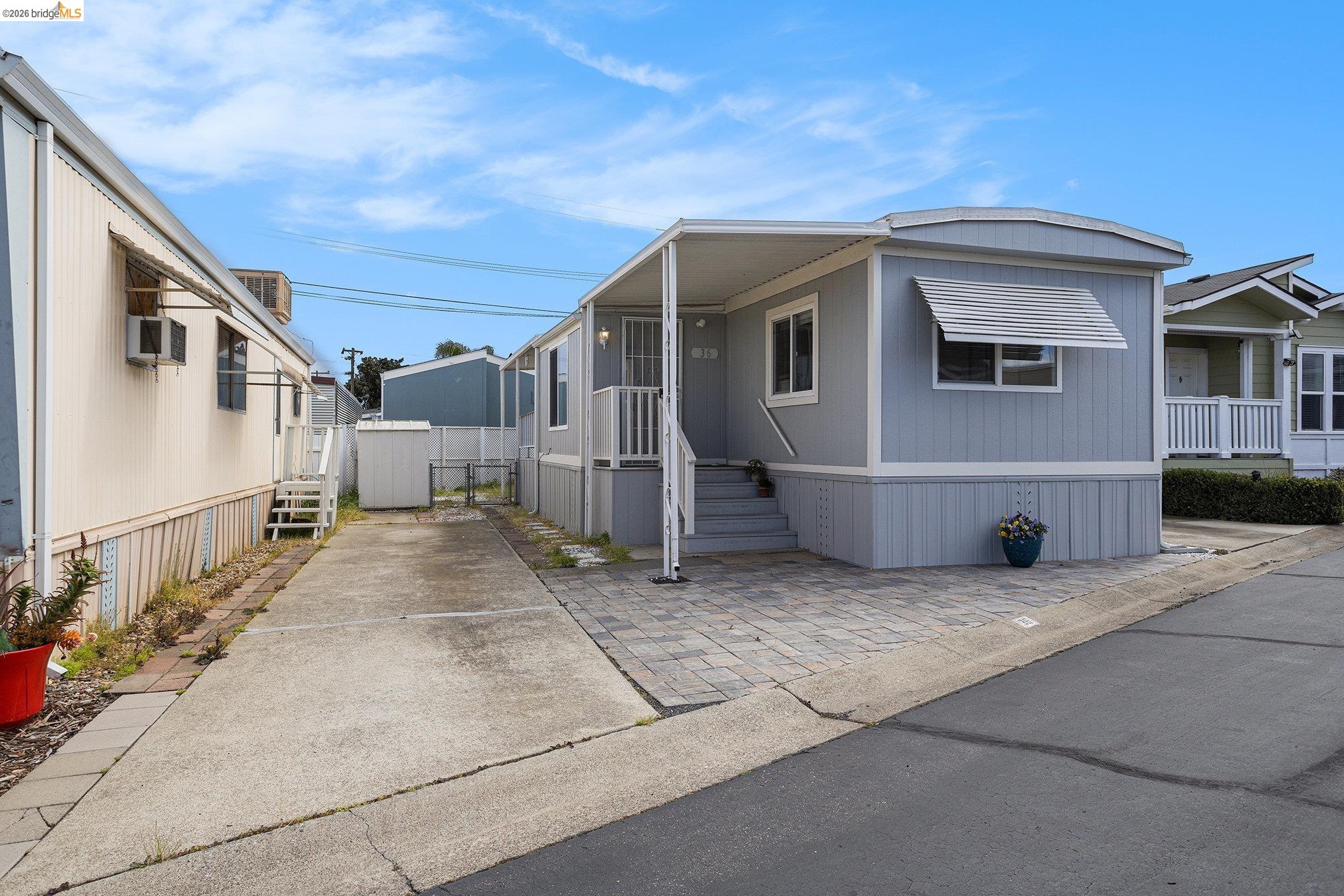 36 Cayuga Street Oakley, CA 94561 - Photo 2 of 25 Manufactured / mobile home featuring a gate and driveway